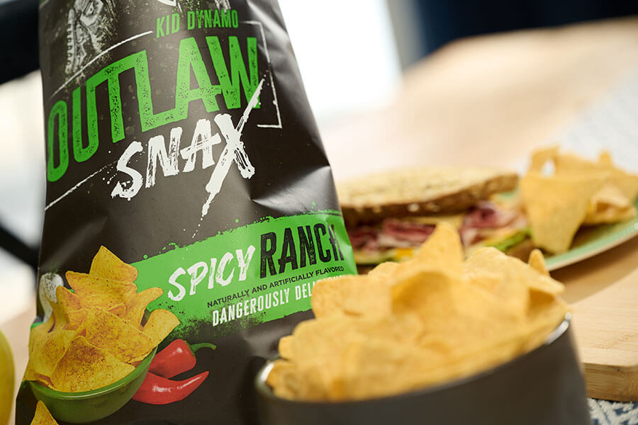 Outlaw Snax Spicy Ranch flavored tortilla chips served as part of a casual lunch.