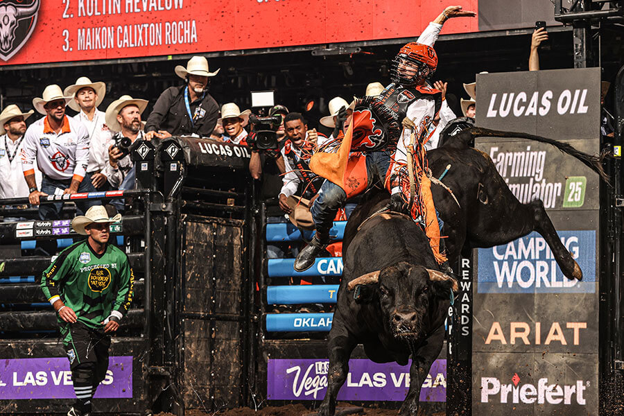 KC Outlaws bull rider in action during a Professional Bull Riders competition.